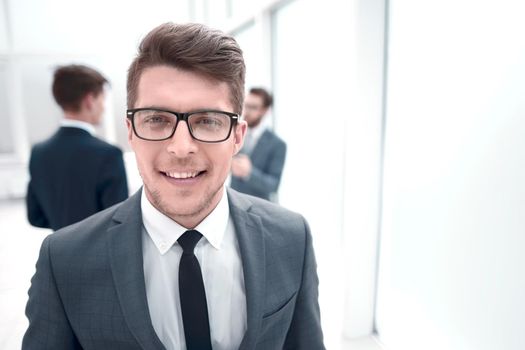 close up.successful young businessman on blurred office background.