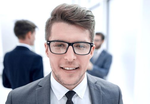 close up.successful young businessman on blurred office background.