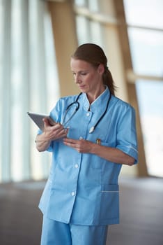 portrait of female doctor with  tablet computer at hospital