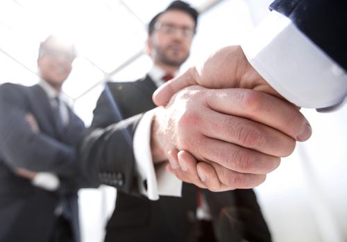 business background.business handshake.the concept of cooperation