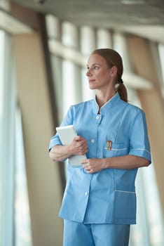 portrait of female doctor with  tablet computer at hospital