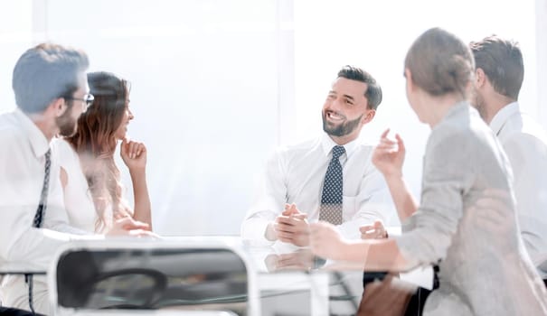 close up.business team sitting at the Desk.photo with copy space