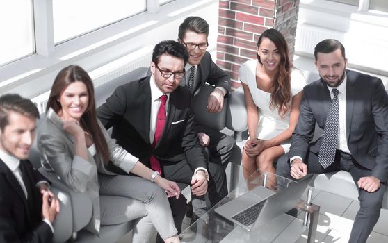 senior businessman and business team sitting in the lobby of the modern office.business meeting