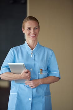 portrait of female doctor with  tablet computer at hospital