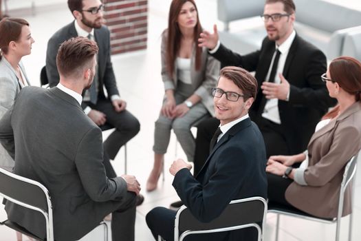 young employee sitting at a seminar on team building.business concept