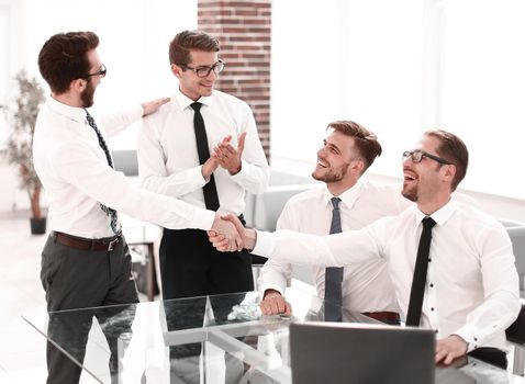 business colleagues shaking hands in the workplace.photo with copy space