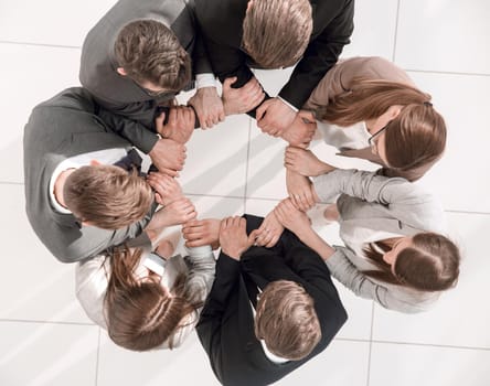 top view. business team forming a circle.photo with copy space