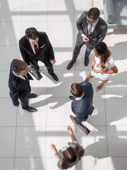 top view.a group of business people standing on a marble floor. business concept