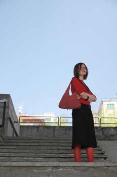 girl with red sox posing on stairs 