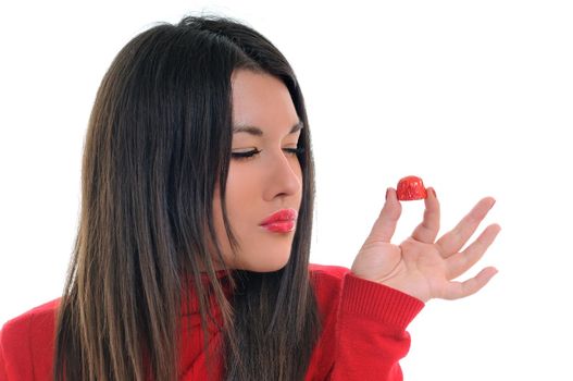 young woman isolated on white in red shirt eat sweet tasty chocolate