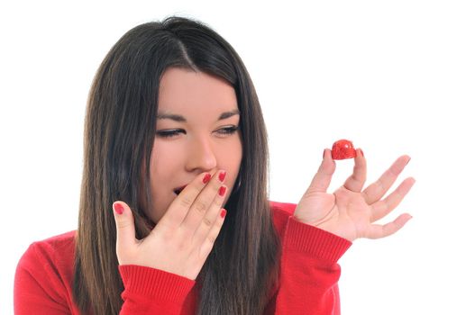 young beautiful brunette woman in red isolated on white eat chocolate food