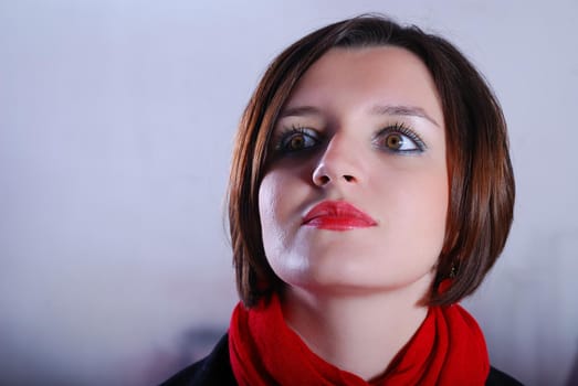 Portrait of a young woman wearing red scarf