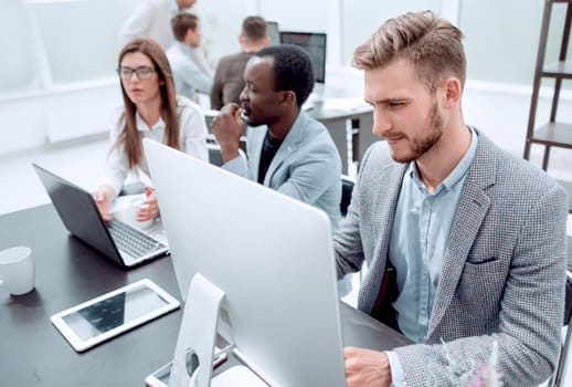 company's employees work in a modern office .people and technology