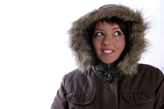 Cute young woman smiling in winter jacket