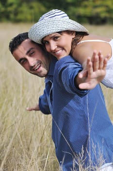 happy young couple have romantic time outdoor while smiling and hug