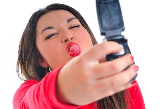 young business woman in red isolated on white talking on cell phone