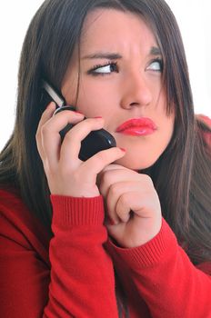 young business woman in red isolated on white talking on cell phone