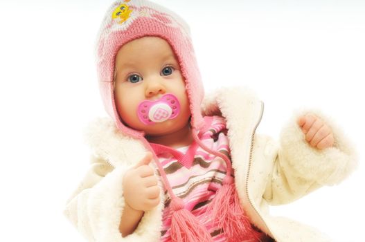 cute happy little baby with winter hat and coat isolated on white