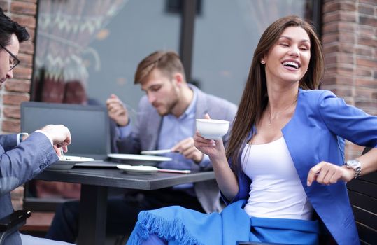 business woman sitting at a table in a cozy cafe.lunch break