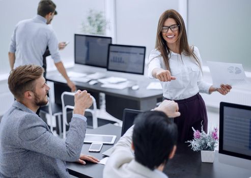 young employees with a gesture of showing their success .the concept of teamwork