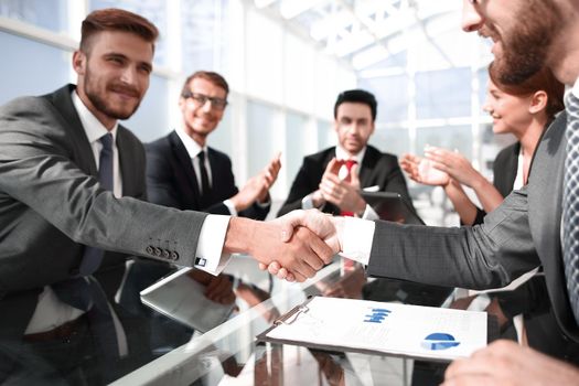 handshake business partners over the Desk.concept of partnership