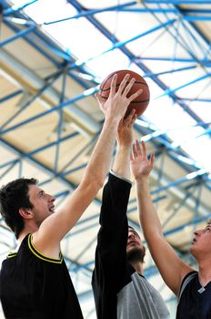 competition cencept with people who playing basketball in school gym