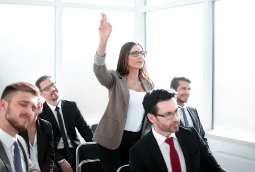 business woman asks a question at a business meeting.business concept