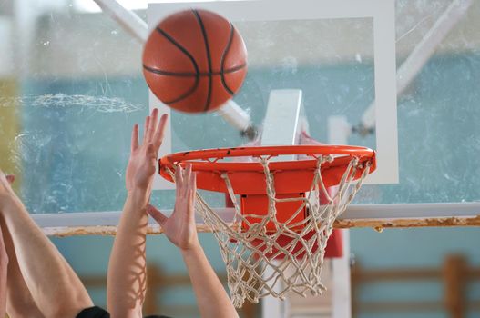 competition cencept with people who playing basketball in school gym