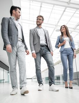 in full growth.a group of business people in the office hall