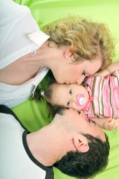 young happy family with beautiful baby playing and smile  isolated on white