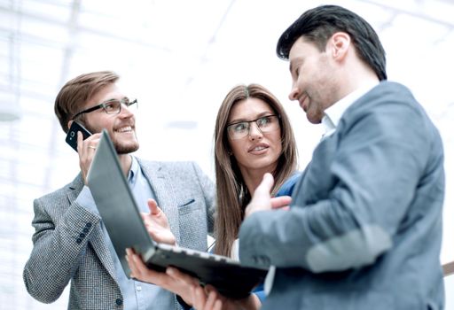 close up.business colleagues using gadgets. people and technology