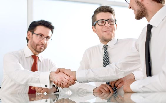 employees greet each other with a handshake.business concept