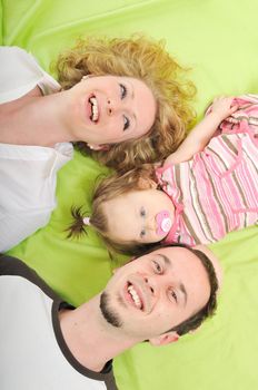 young happy family with beautiful baby playing and smile  isolated on white in studio 