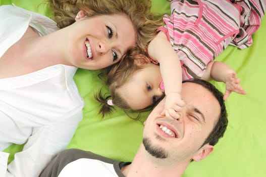 young happy family with beautiful baby playing and smile  isolated on white