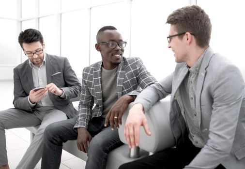 group of employees sitting in the office lobby.photo with copy space