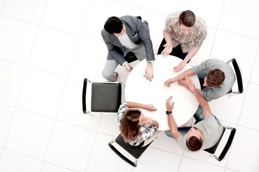 top view.Manager and creative team sitting at the round table.photo with copy space