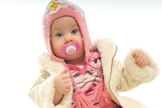 cute happy little baby with winter hat and coat isolated on white