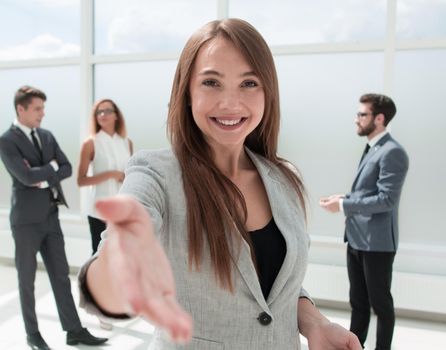 young business woman holding out her hand for a handshake.concept of partnership