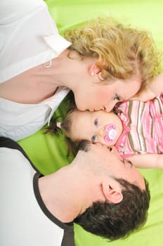 young happy family with beautiful baby playing and smile  isolated on white