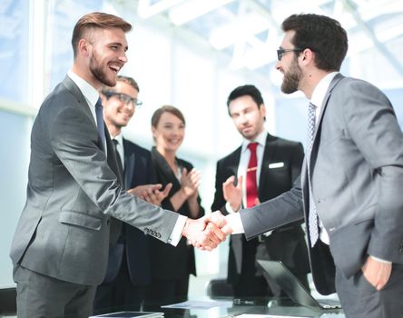 handshake of business people in a modern office.concept of partnership