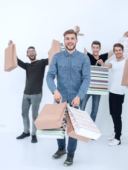 group of cheerful young people with shopping bags.photo with text space