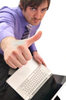 young business man in pink work on laptop isolated