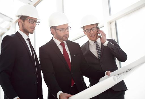 businessmen and architects inspect the new building.photo with text space