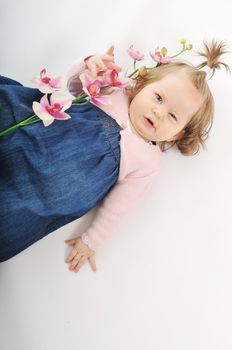 one happy  baby child isolated on white background with flower