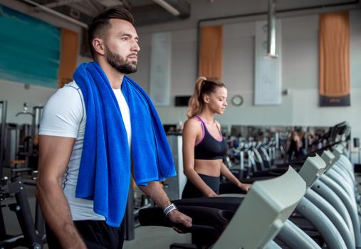 close up. attractive man running on a treadmill. healthy lifestyle