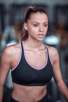 close up.portrait of a confident young woman in the gym. healthy lifestyle
