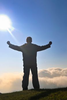 healthy young man practice yoga in height mountain at early morning and sunrise