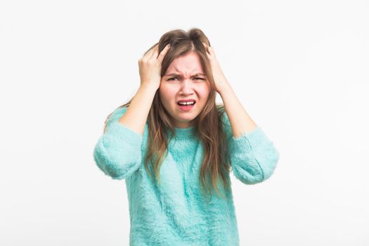 Concerned scared woman on white background in studio