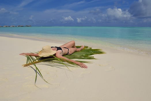 happy young woman on summer vacation on beautiful tropical beach have fun and relax