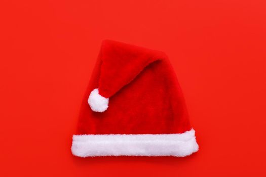 Santas hat on red christmas background with copy space for text